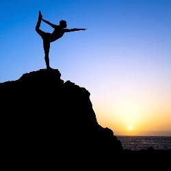 Yogi balanced on a Rock overlooking the Sea